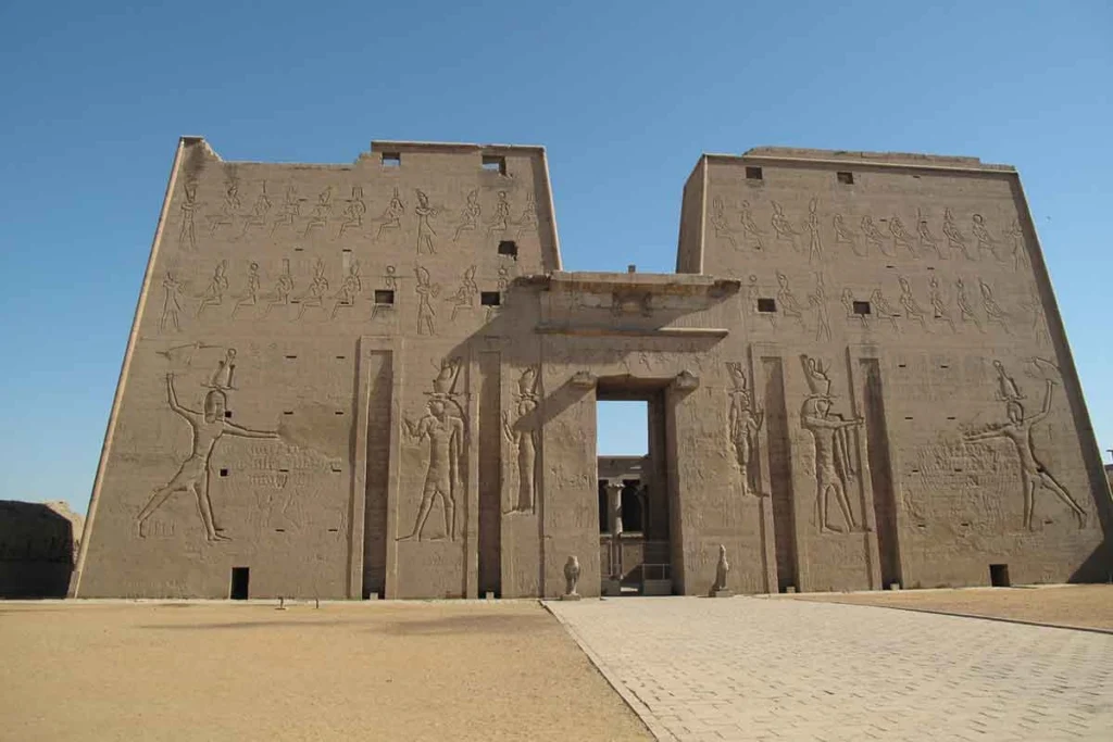Exterior view of Edfu Temple façade with pylons and carvings.